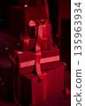 Luxury red gift boxes with satin ribbons for premium celebrations 135963934