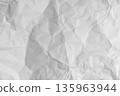 Old crumpled paper sheet with torn edges and weathered texture. Blank white background ideal effect. 135963944