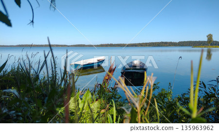 A large, beautiful lake on a summer day. A large, beautiful lake on a summer day. 135963962