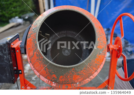 Portable Concrete Mixer on Construction Site with Rebar Reinforcement  135964049