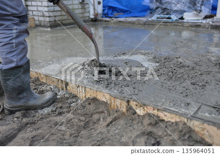Portable Concrete Mixer on Construction Site with Rebar Reinforcement  135964051