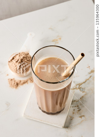 protein powder in scoop. dry mixture for preparation of sporting or dietary drink. protein powder in scoop. dry mixture for preparation of sporting or dietary drink. 135964300