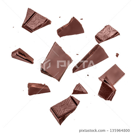 Dark chocolate pieces isolated on white background Dark chocolate pieces isolated on white background 135964800