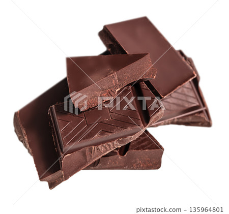 Stack of dark chocolate pieces isolated on white background Stack of dark chocolate pieces isolated on white background 135964801