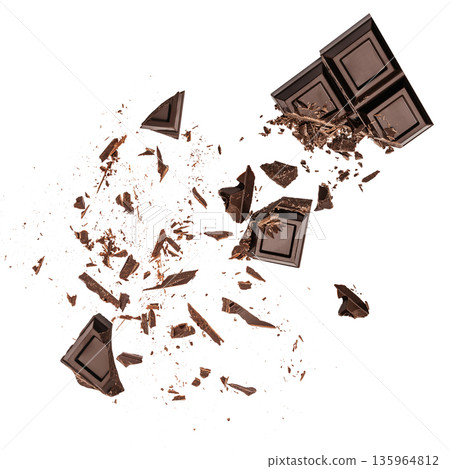 Broken dark chocolate pieces with scattered crumbs on white background Broken dark chocolate pieces with scattered crumbs on white background 135964812