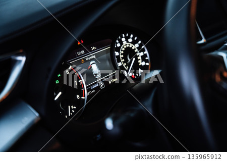 Modern Car Dashboard with Digital Instrument Cluster at Night 135965912
