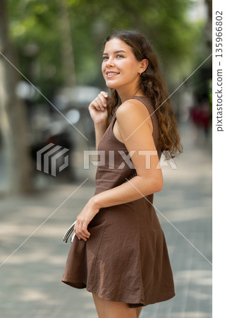 Young woman walking around summer european city Young woman walking around summer european city 135966802