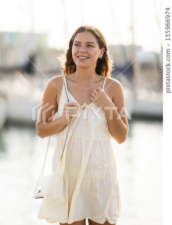 Young woman posing at yacht port 135966974