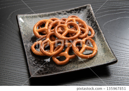 Pretzels, a baked confectionery originating from Germany Pretzels, a baked confectionery originating from Germany 135967851