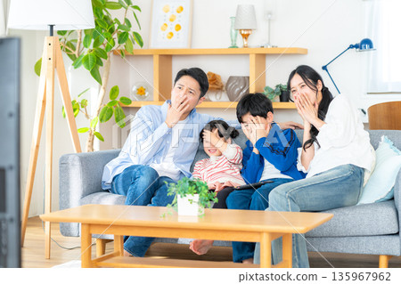Family watching TV 135967962