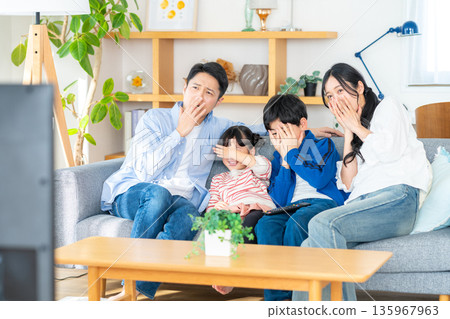 Family watching TV Family watching TV 135967963