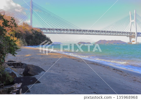 The roots of Iwaguro Island, Kurohama Coast with its rolling diorite and the Seto Ohashi Bridge (Shiwaku Islands, Seto Inland Sea) The roots of Iwaguro Island, Kurohama Coast with its rolling diorite and the Seto Ohashi Bridge (Shiwaku Islands, Seto Inland Sea) 135968968