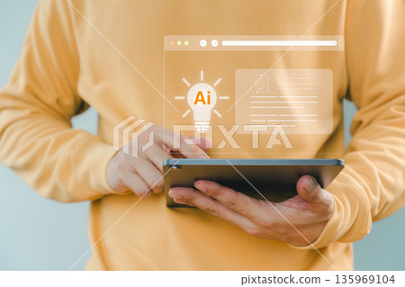 Person using tablet with AI innovation and light bulb icon, representing artificial intelligence, digital creativity, smart technology development, modern innovation, and intelligent solution concept. Person using tablet with AI innovation and light bulb icon, representing artificial intelligence, digital creativity, smart technology development, modern innovation, and intelligent solution concept. 135969104