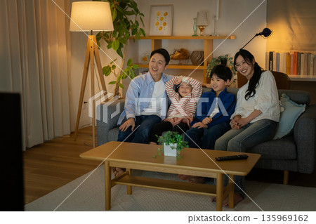 Family watching TV Family watching TV 135969162
