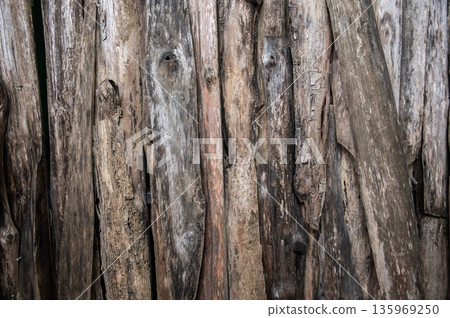 Full frame shot of wood wall made by various size of wood. Wooden wall used in building construction offer significant environmental benefits for aesthetic, economic etc. Full frame shot of wood wall made by various size of wood. Wooden wall used in building construction offer significant environmental benefits for aesthetic, economic etc. 135969250