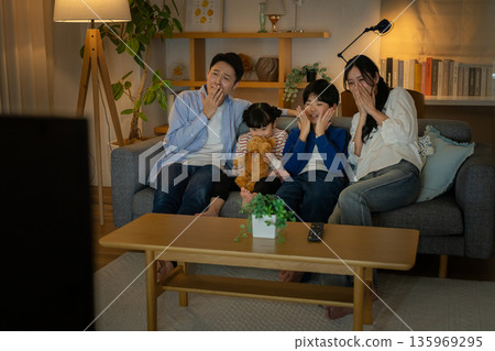 Family watching TV 135969295