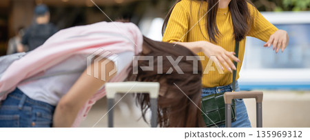 A woman sorting her luggage at the airport. Photo courtesy of Kansai International Airport (KIX) A woman sorting her luggage at the airport. Photo courtesy of Kansai International Airport (KIX) 135969312