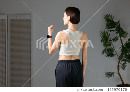 Woman doing muscle training 135970176
