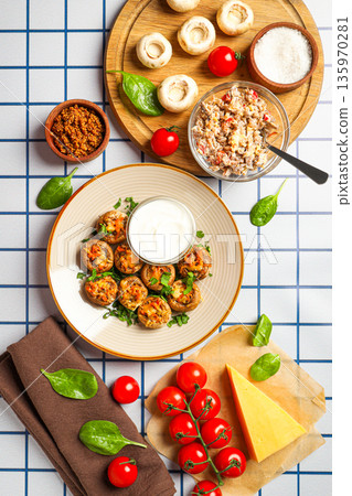 Variety of food items including stuffed mushrooms and cheese 135970281