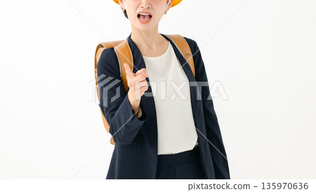 An adult woman carrying a school bag 135970636