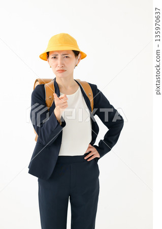 An adult woman carrying a school bag An adult woman carrying a school bag 135970637