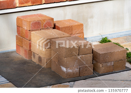 Stacked brick blocks - Stock of building materials 135970777