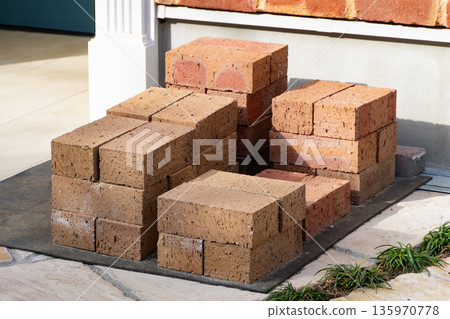 Pile of bricks placed outdoors - Image of construction site materials 135970778