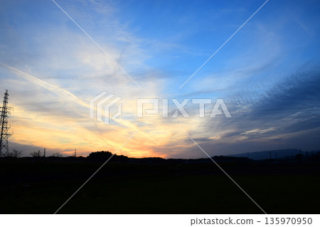 Image of a sunset-colored sky and a steel tower Image of a sunset-colored sky and a steel tower 135970950