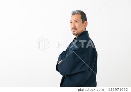 A man wearing a kimono A man wearing a kimono 135971032