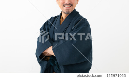 A man wearing a kimono A man wearing a kimono 135971033