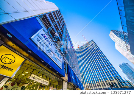 Tokyo cityscape, Japan, January 25. View of KEIO Shinjuku Station, Nishi-Shinjuku 1-Chome District Project, and cranes. Tokyo cityscape, Japan, January 25. View of KEIO Shinjuku Station, Nishi-Shinjuku 1-Chome District Project, and cranes. 135971277