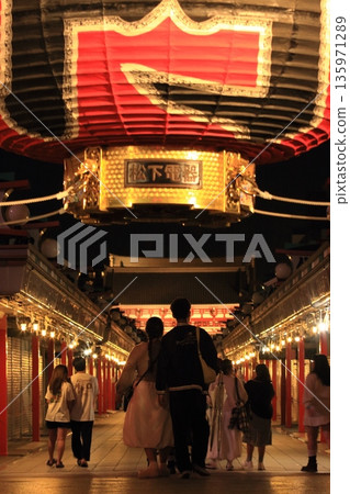 A couple visiting Sensoji Temple at night 135971289