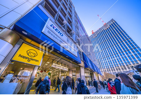 Tokyo cityscape, Japan, January 25. View of KEIO Shinjuku Station, Nishi-Shinjuku 1-Chome District Project, and cranes. 135971399
