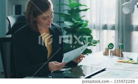 Skilled manager walk around meeting table with green business. Alimentation. 135972289