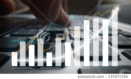 Business Growth Analysis with Graphs, Charts, and Financial Data on a Laptop Keyboard Displaying Trends and Performance Statistics in a Modern Office Copula 135972390