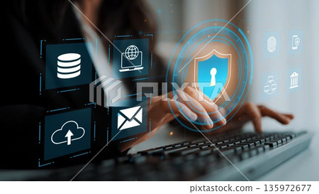 Modern Cyber Security Concept with Digital Shield, Database Icons, and Cloud Technologies on Keyboard in Office Environment Gluon 135972677
