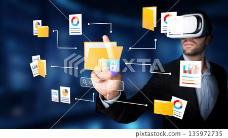 Businessman Using Virtual Reality to Navigate Digital Folders and Visualize Data in a Futuristic Work Environment Gluon 135972735