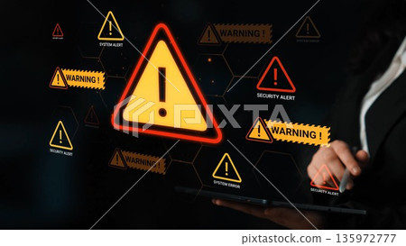 Bright warning and alert symbols illuminated on modern device screen highlighting system alerts and security issues in technology and cybersecurity context Gluon 135972777