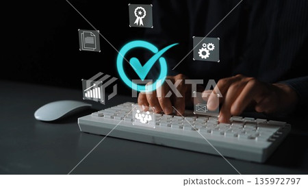 Hands typing on a keyboard with floating icons representing checking, rewards, settings, and documents for digital project management and productivity Gluon 135972797