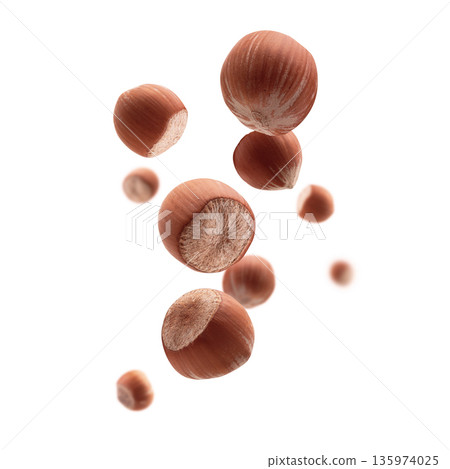 Ripe hazelnuts levitate on a white background Ripe hazelnuts levitate on a white background 135974025