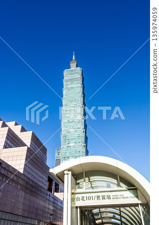 View of the Taipei 101 skyscraper behind the MRT station entrance in Xinyi Financial District, Taipei, Taiwan. 135974059