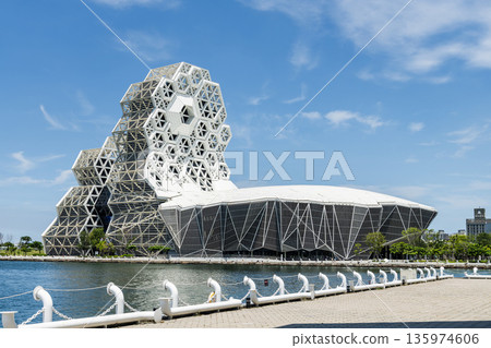 Close-up of Kaohsiung Music Center in Port of Kaohsiung, Taiwan. The white hexagonal building structure on the shore of Love Pier. Close-up of Kaohsiung Music Center in Port of Kaohsiung, Taiwan. The white hexagonal building structure on the shore of Love Pier. 135974606