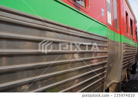 Trains and tracks of the Maeklong Railway in Bangkok, Thailand Trains and tracks of the Maeklong Railway in Bangkok, Thailand 135974810