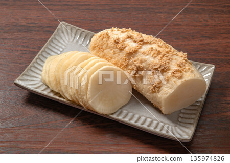 Uncolored pickled radish on a black background 135974826