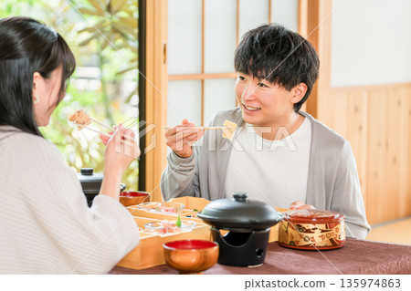 Married couples and couples enjoying kaiseki cuisine at a ryokan (in-room dining, kaiseki cuisine, set menu, luxury) 135974863