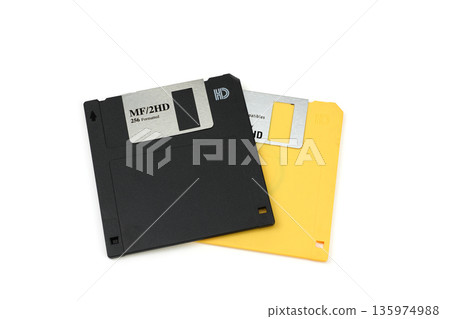 Yellow and black floppy disks 135974988