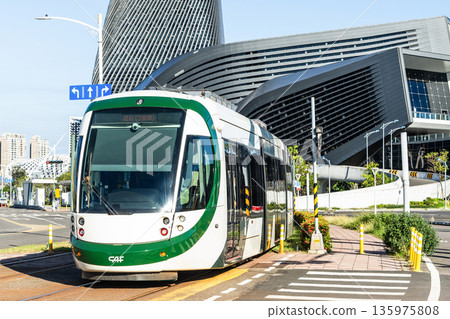 The circular light rail train drives past the Kaohsiung Port Cruise Terminal station in Taiwan. 135975808