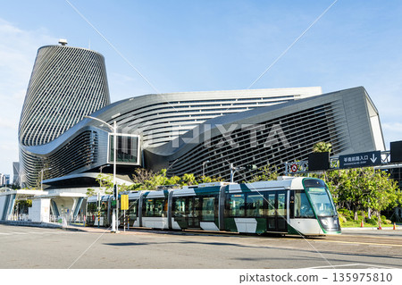 The circular light rail train drives past the Kaohsiung Port Cruise Terminal station in Taiwan. The circular light rail train drives past the Kaohsiung Port Cruise Terminal station in Taiwan. 135975810