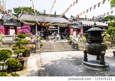 Building view of the Pou Chai Temple (Kun Iam Tong) in Macau, the main hall dedicated to Kun Iam. Building view of the Pou Chai Temple (Kun Iam Tong) in Macau, the main hall dedicated to Kun Iam. 135976181