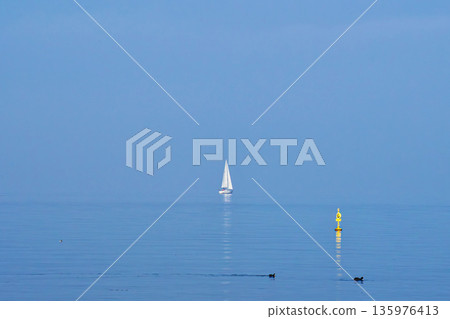 A yacht floating on Lake Biwa, hazy with yellow sand A yacht floating on Lake Biwa, hazy with yellow sand 135976413